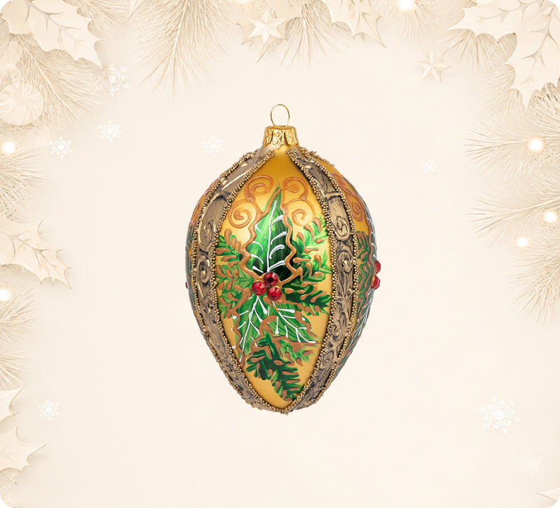 Gold glass egg ornament painted with holly