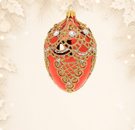 Red Fabergé style glass egg ornament with gold lace
