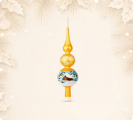 Gold glass tree topper painted with a winter cottage
