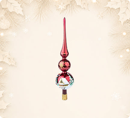 Red glass tree topper painted with a cottage